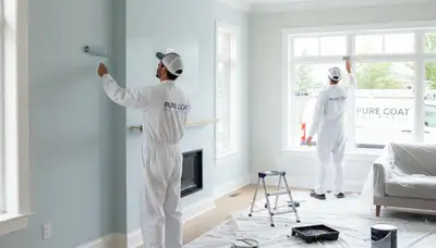 Professional interior house painters in Saint Louis, MO applying fresh wall color for a durable finish
